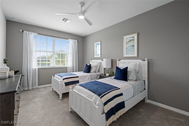 Bedroom featuring visible vents, baseboards, ceiling fan, and light carpet | Image 28