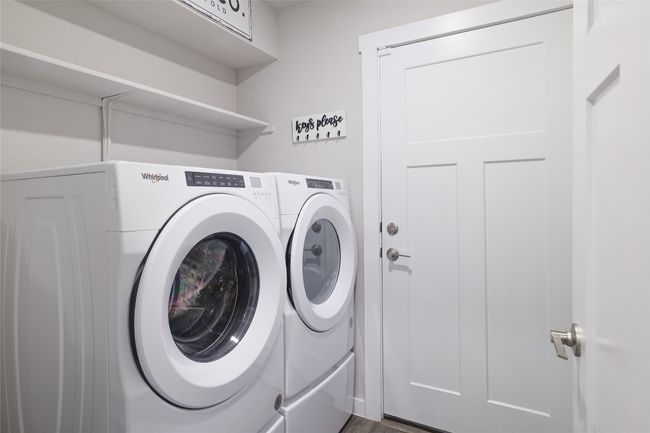 Laundry room with shelving | Image 23