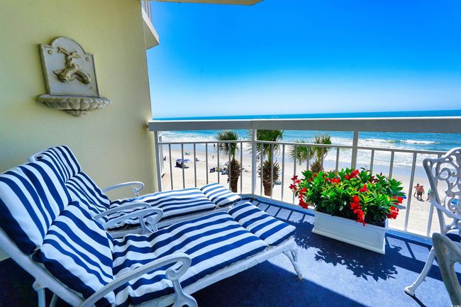 Balcony with view of water and beach | Image 4