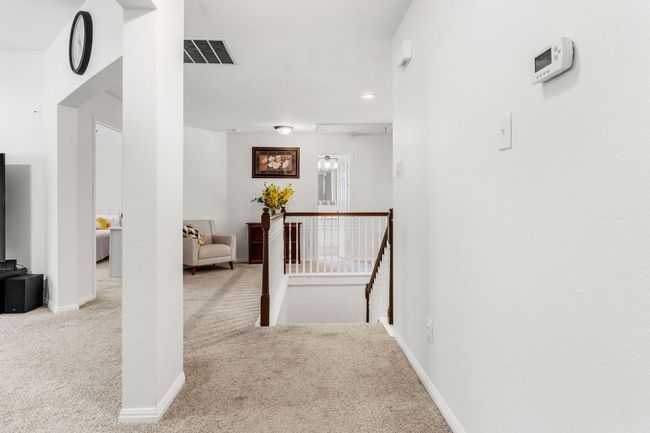 Hall with an upstairs landing, carpet floors, recessed lighting, and baseboards | Image 30
