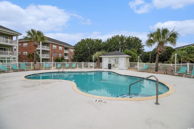 Community pool with a patio | Image 19