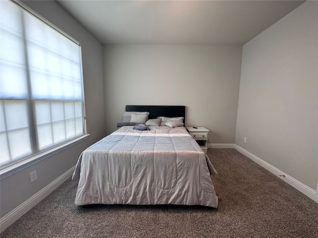 Bedroom with carpet and baseboards | Image 13
