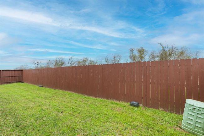 well-maintained green lawn wooden privacy fence. | Image 37