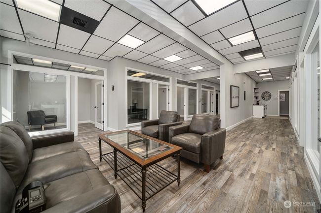 Open siting area with offices on each side. | Image 5