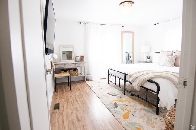 Bedroom featuring light wood-style floors | Image 19