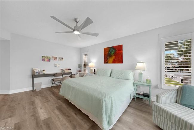 Bedroom featuring ceiling fan and light hardwood / wood-style flooring | Image 22