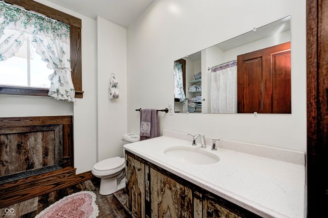 full bath with toilet, wood finished floors, and vanity | Image 43