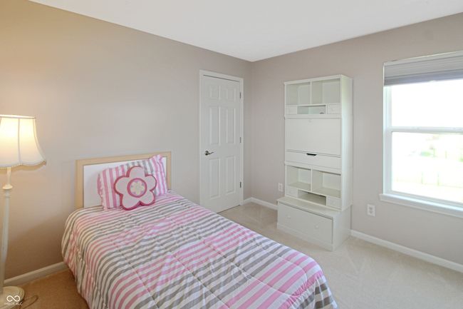 Bedroom 3 features a walk in closet and enjoys views of the backyard. | Image 15