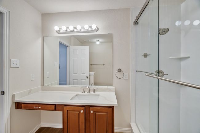 Bathroom with vanity and a walk-in shower | Image 25