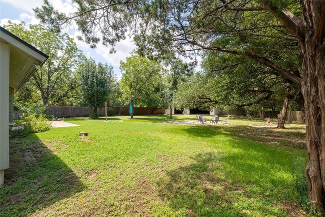 The completely fenced in yard holds endless opportunities for enjoyment. | Image 31