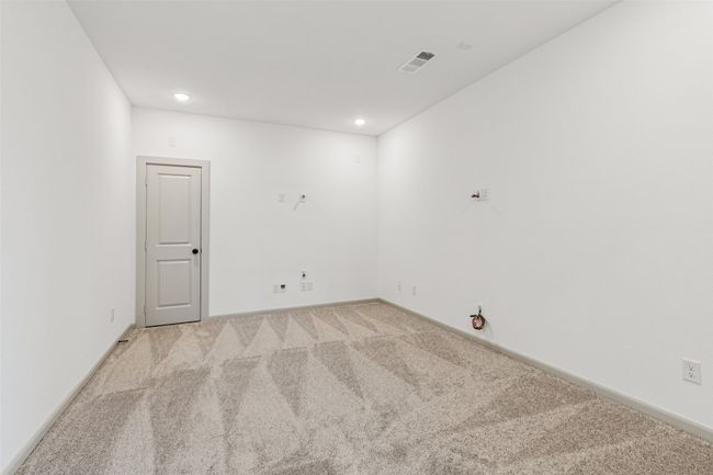 This spacious media room is adjacent to the game room creating the ultimate family entertainment area! | Image 16