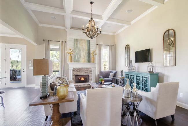 Another view of the living room with a brick-surround gas fireplace. | Image 17