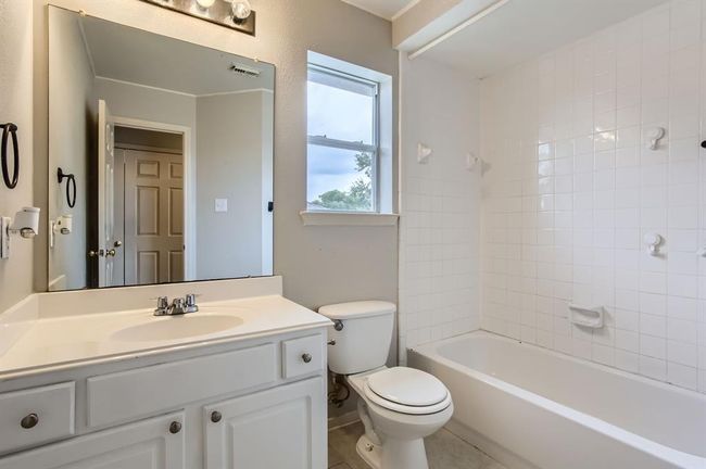 Upstairs hall bathroom with beautiful brand new tile flooring. | Image 33