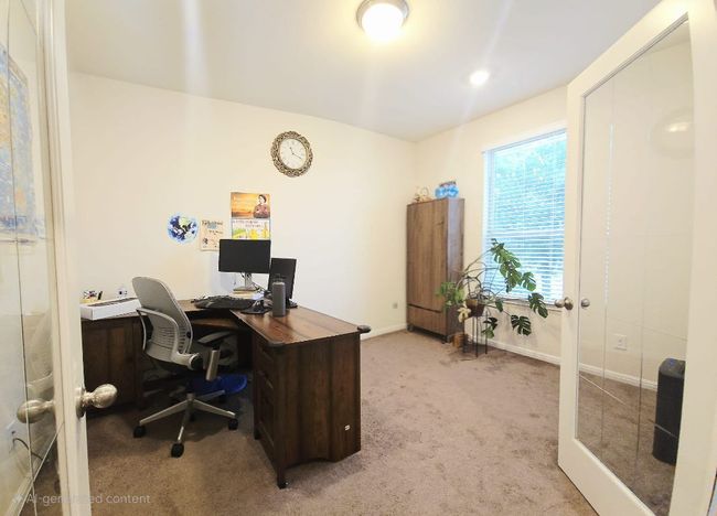 Carpeted office with baseboards and french doors | Image 18