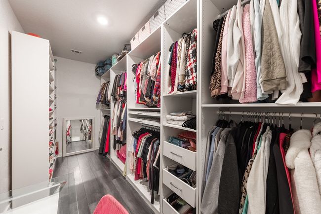 Spacious closet with visible vents and wood finished floors | Image 4
