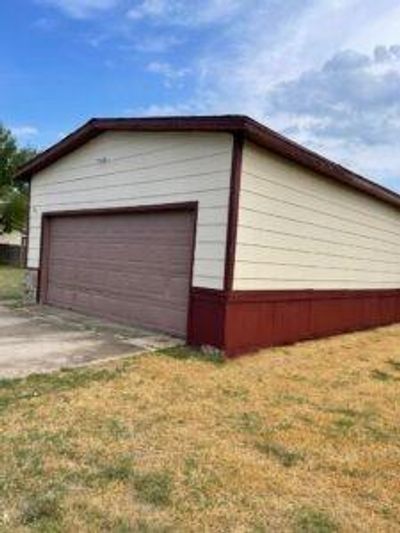 Garage with wood walls | Image 2