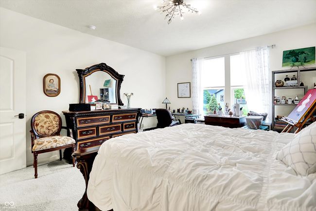 Primary bedroom featuring big windows and carpet | Image 14