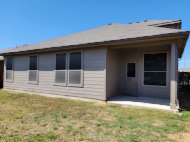 Rear view of house featuring a patio area and a yard | Image 27