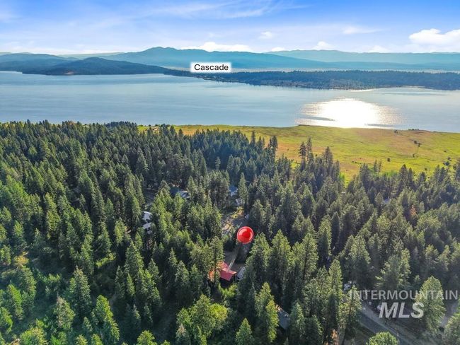 Aerial view of a water and mountain view and a heavily wooded area | Image 14