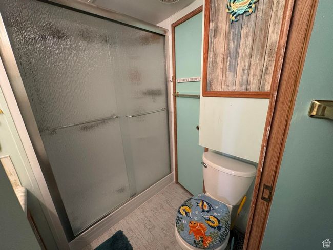 Full bath with wood finished floors and a stall shower | Image 18