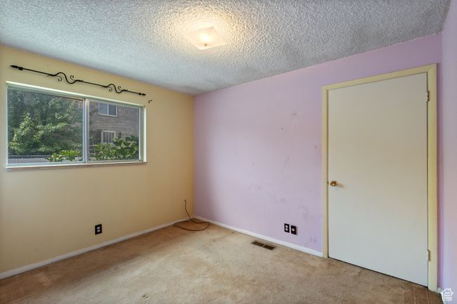 Spare room with carpet flooring and a textured ceiling | Image 23