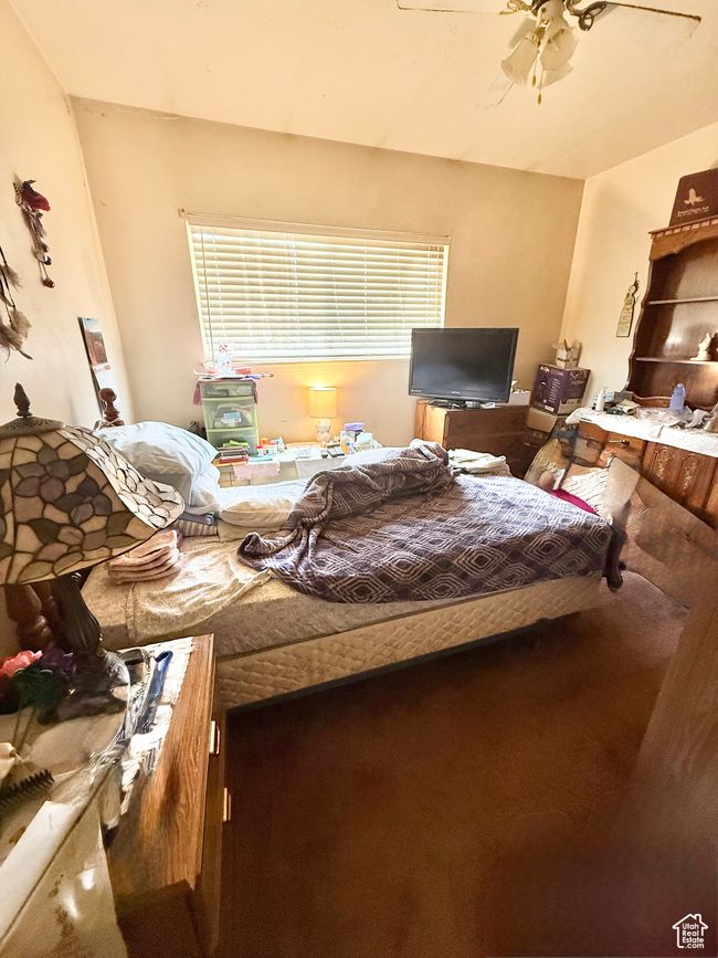 Bedroom featuring ceiling fan | Image 7