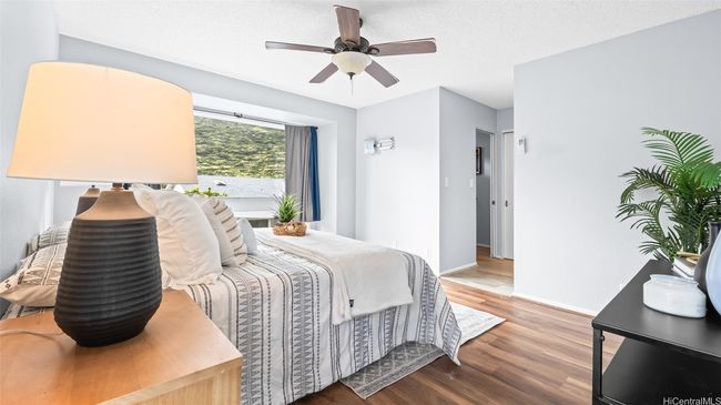 Professionally staged; primary bedroom | Image 13