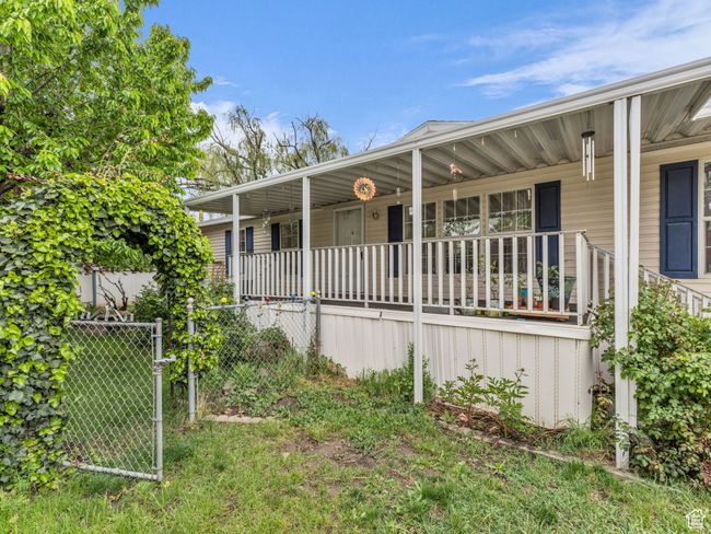 View of front of house with covered porch and fence | Image 23