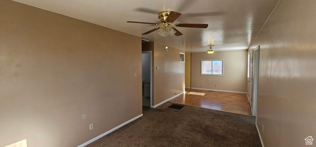 Empty room featuring ceiling fan and hardwood / wood-style flooring | Image 14