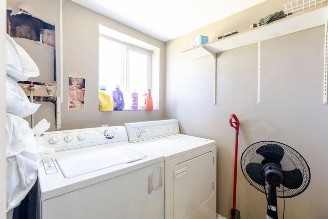 Laundry room with separate washer and dryer | Image 11