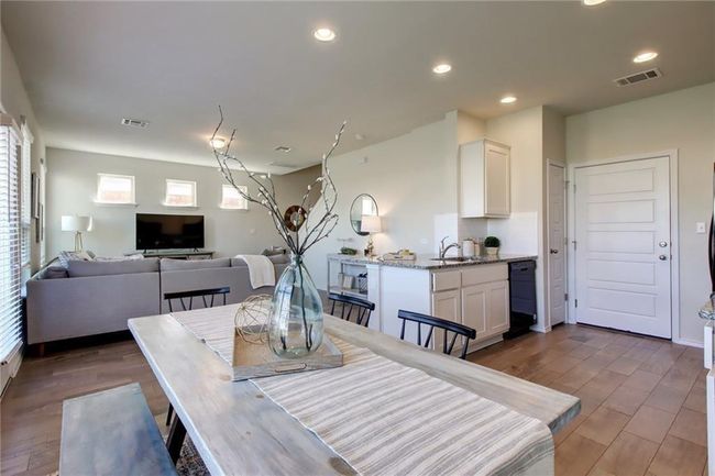 Dining space with plenty of natural light, light wood-type flooring, and recessed lighting | Image 10