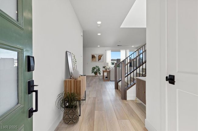***Virtually Staged** Foyer featuring recessed lighting, light wood-style floors, and stairway | Image 6