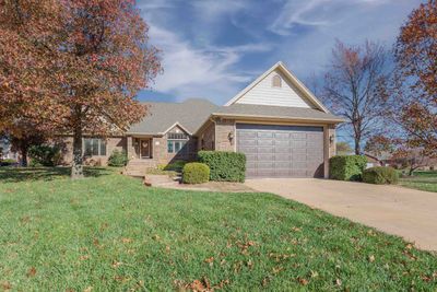 View of front facade featuring a garage and a front lawn | Image 2