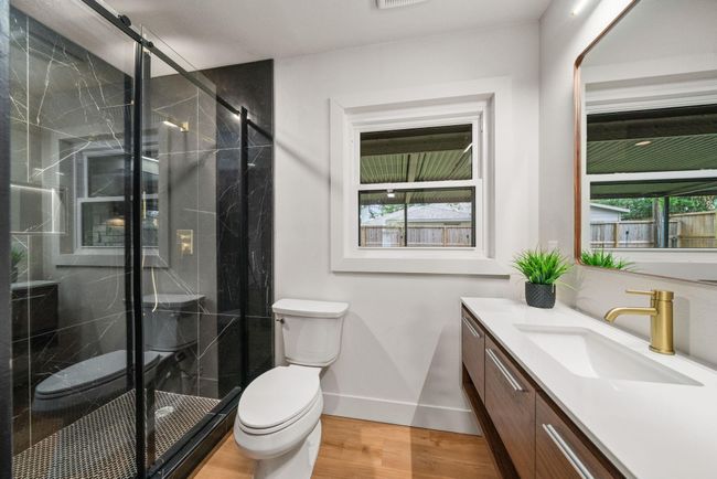 Spacious and stunning dedicated en suite for the third guest bedroom. Notice the lighted shower niche! | Image 18