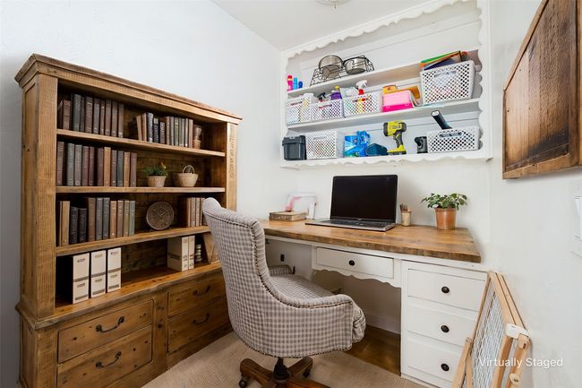 Office space with built in desk and wood finished floors | Image 36
