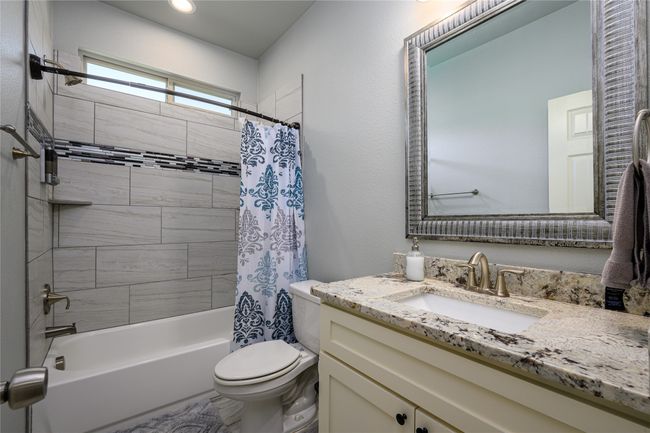 Full bathroom featuring vanity, shower / tub combo. | Image 12