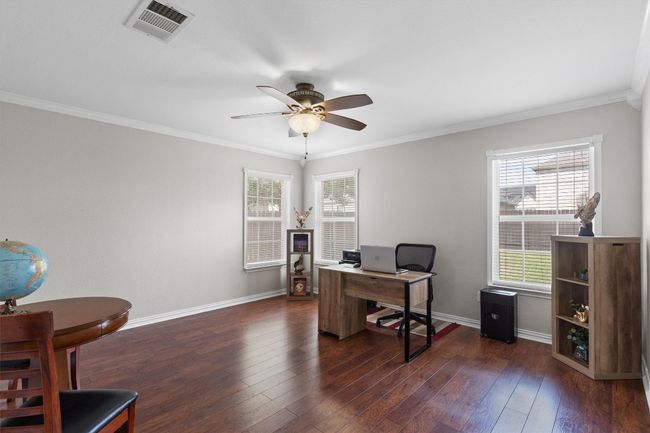 versatile bedroom currently used as an office. | Image 15