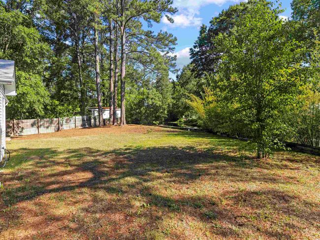 View of yard featuring fence | Image 26