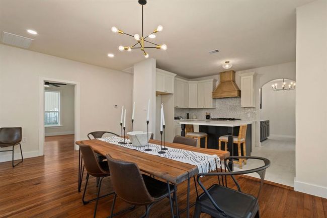 Linking the family room and kitchen, this formal dining room offers plenty of space for hosting gatherings. | Image 12
