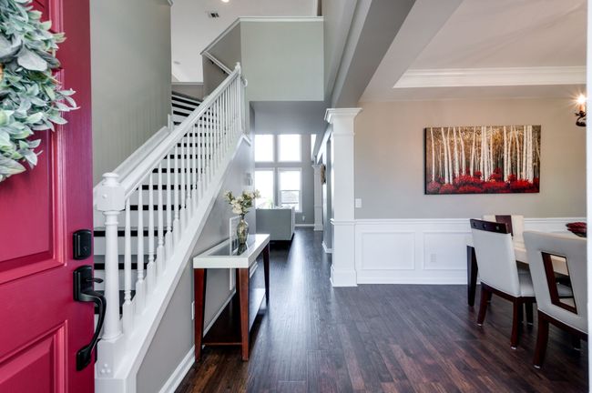 Step into the home and be greeted by lovely LVP floors throughout the main level. | Image 7