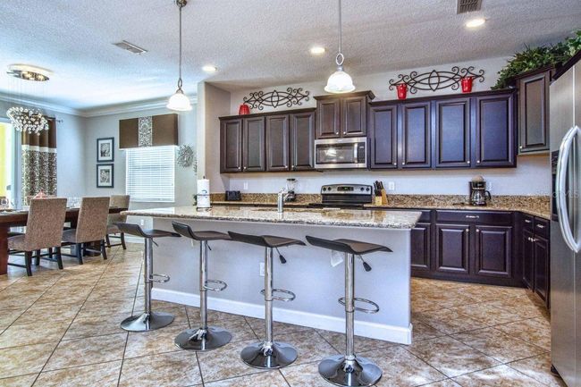 8864 Candy Palm Road, House other with 6 bedrooms, 5 bathrooms and null parking in Kissimmee FL | Image 4