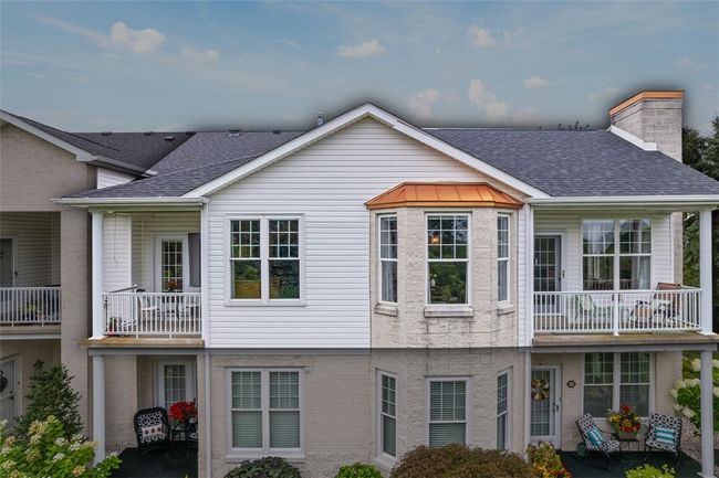 Notice the patios on the right and to the left which provide a lovely extension of the living space. | Image 18