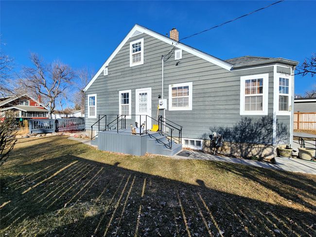 Back of property featuring a yard and a chimney | Image 6