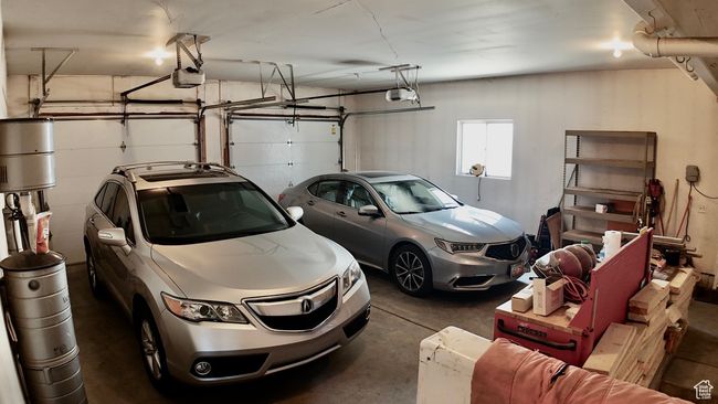 Garage featuring a garage door opener | Image 63