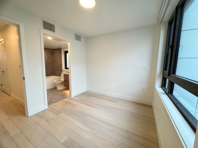 Empty room featuring light wood-type flooring, baseboards, and visible vents | Image 40
