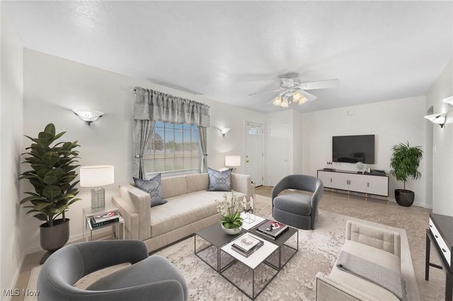 Living room with ceiling fan | Image 6