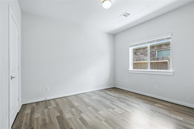 Spacious third bedroom. | Image 7