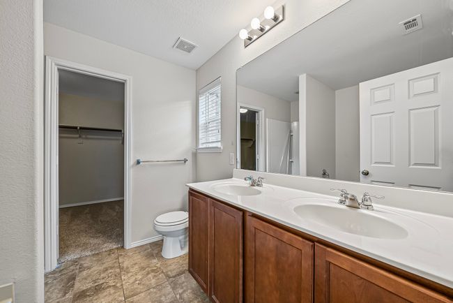 Full bathroom with double vanity and a spacious closet | Image 22