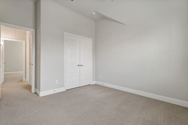 Unfurnished bedroom featuring baseboards, carpet floors, and a closet | Image 24