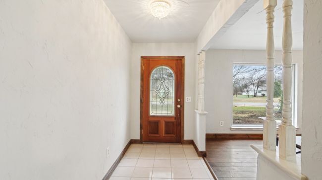 Foyer entrance featuring light wood-style flooring and baseboards | Image 4